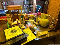 Overall lot showing pitcher, trophies, driver, targets and miscellaneous decor