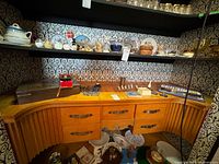 Lot overview on cabinet with flatware chest, candleholders, napkin rings and accessories