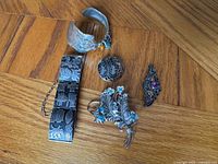 All five sterling jewellery pieces laid out