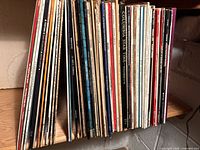 Shelf showing entire row of assorted vinyl albums