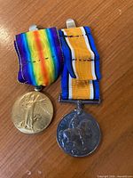 Front view of both medals with ribbons attached