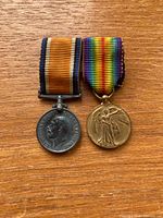 Front view of both medals with ribbons