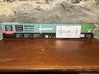 Front of sealed box showing JONAX tilting wall mount