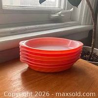 Stacked side view of dishes showing exterior color and shape