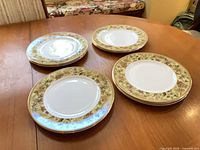 Stack of multiple Floral Tapestry dinner plates showing overall lot