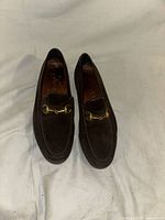 Top view of both loafers showing suede uppers and hardware