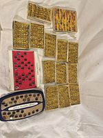 Multiple trays filled with gold-tone rings in assorted styles