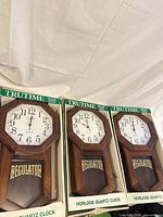 Three Trutime regulator quartz wall clocks in boxes