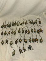 Overview of all 40 Michelangelo TMNT keychains spread on fabric