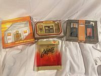 All four boxed cologne sets laid out