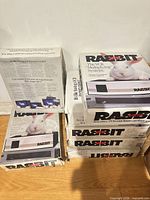 Stack of seven Rabbit TR-7000 boxed units