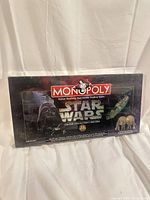 Front view of sealed Star Wars Monopoly box