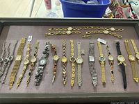 Full layout of watches and matching bracelets in display case