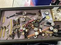 Tray of assorted women’s quartz watches and parts