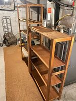 Both wooden shelving units side by side showing overall structure and tier count