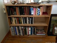 Front view of three-tier wooden bookshelf