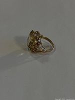 Side profile of ring showing citrine depth and claw setting