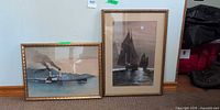 Both framed prints side by side