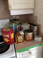 Group shot of all tins and shakers on countertop