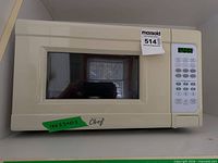 Front view of beige Master Chef microwave showing door, window, and overall size