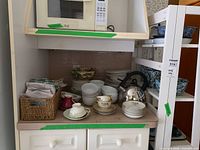 Overview of mixed kitchenware on shelf