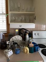 overview of countertop items and open cupboard