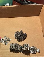 Overview of bracelet, brooch, pendant