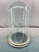 full view of glass dome cloche on base