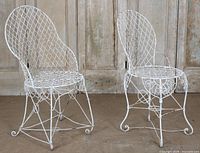 Front view of both wire chairs showing lattice backs and seats