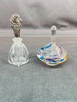 Both perfume bottles side by side for size and form comparison