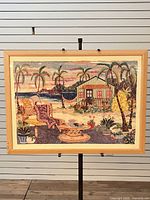 Framed Andrea Beloff print on easel, full view