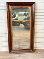 Full view of rectangular mirror with mahogany and gilt frame