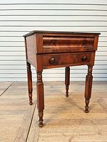 Full view of stand showing drawers and legs