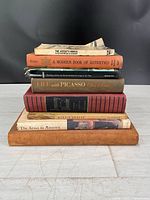 Stack of six art-themed books showing spines