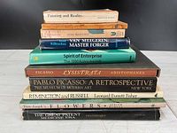 Stack of nine vintage art and history books showing spines and titles