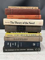 Stack showing all eight books with spines visible