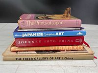 Stack of six Asian art books showing spines and titles