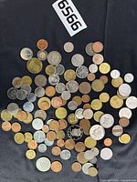 Full spread of mixed coins on black background