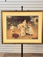 Full view of framed print on stand