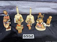 Group shot showing all figurines and bells