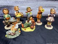 Group view of six Hummel figurines