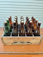 Front view of crate showing branding and bottles