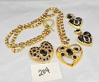 Full set showing necklace, earrings, brooch