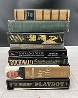 Stack of the eight books showing spines and titles