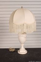Full view of lamp showing marble base and shade