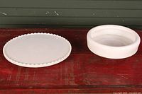 Top view of both milk glass pieces showing tray and basin