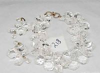 Necklace and earrings laid out showing beads and clasp