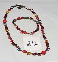 Necklace and bracelet set laid flat showing full designs