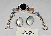 Bracelet with mixed stones and clip earrings overview