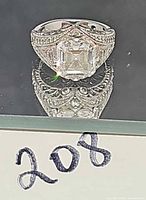 Front view showing square center CZ and filigree details